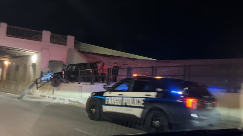 Fargo driver drives onto sidewalk after mistaking intersection, crashes into railing