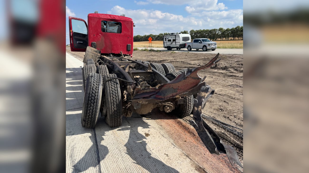 The dump truck sustained significant damage after striking an overhead structure on I-94 near...