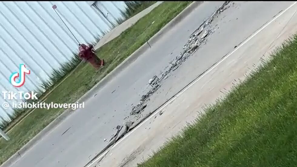 Road buckles under persistent extreme heat in West Fargo, on Friday, May 29, 2026.
