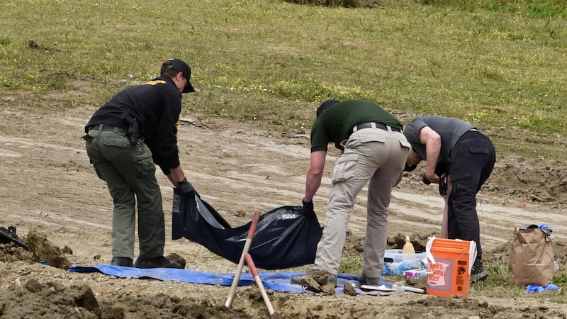 Investigators from the Humboldt County Sheriff's Office search the grounds of Miranda's Rescue...