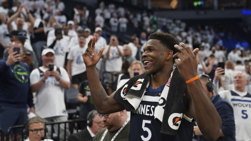 Minnesota Timberwolves guard Anthony Edwards (5) celebrates a win against the Golden State...