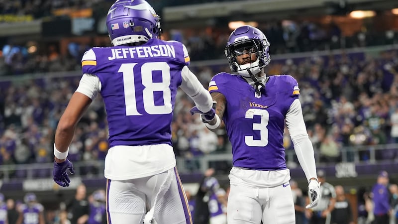 Minnesota Vikings' Jordan Addison celebrates his touchdown catch with Justin Jefferson during...