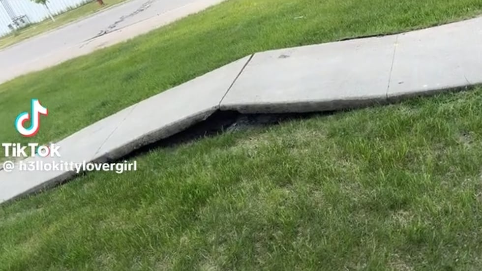 Extreme heat causes a 'tenting' sidewalk in West Fargo on Friday, May 29, 2026.