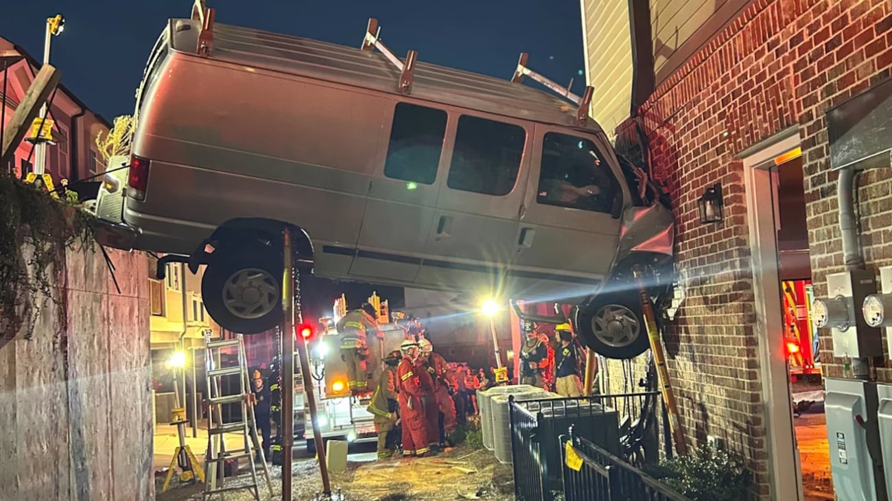 Person injured after van drives into building, Cobb County fire officials say