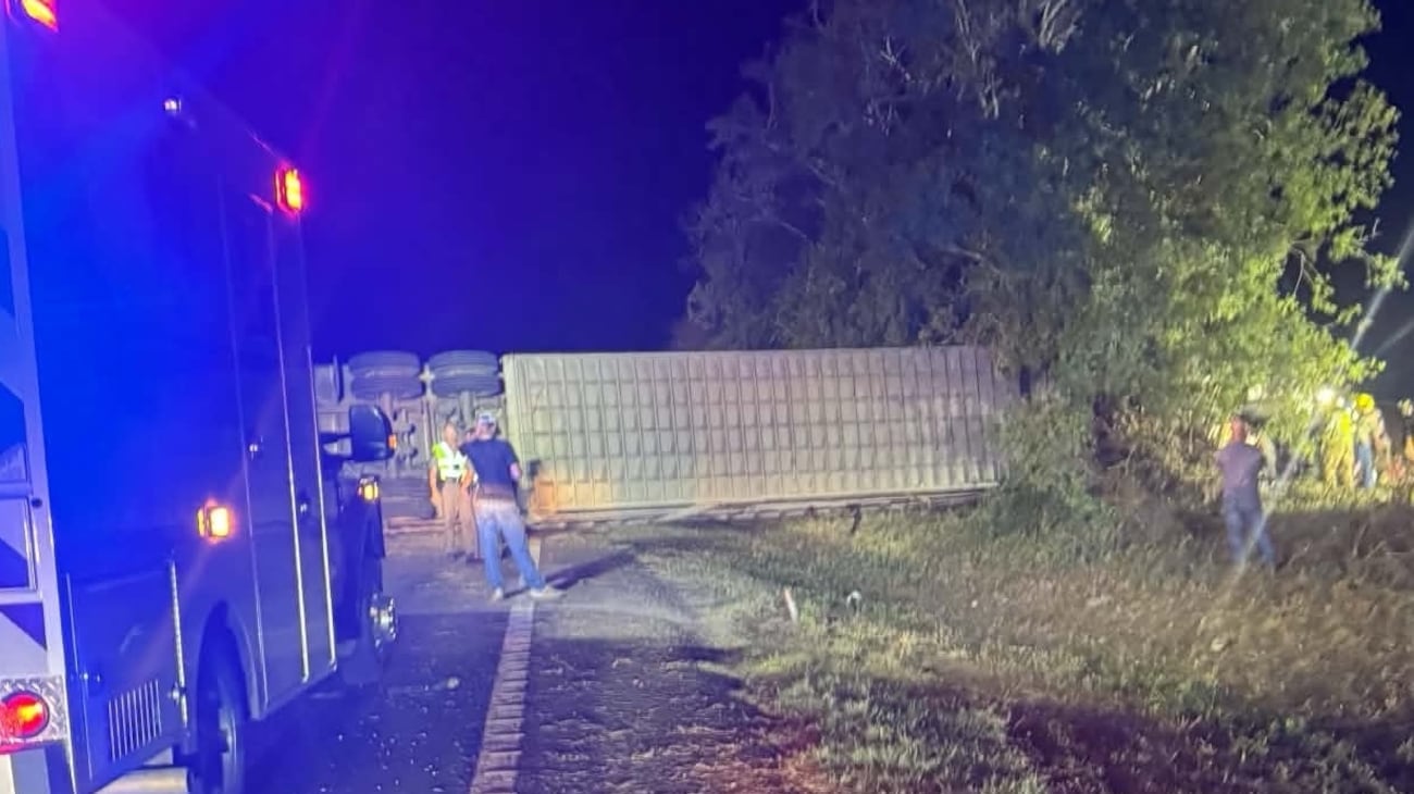 Authorities report the westbound semi veered off FM 485, rolled over, and struck a tree near...