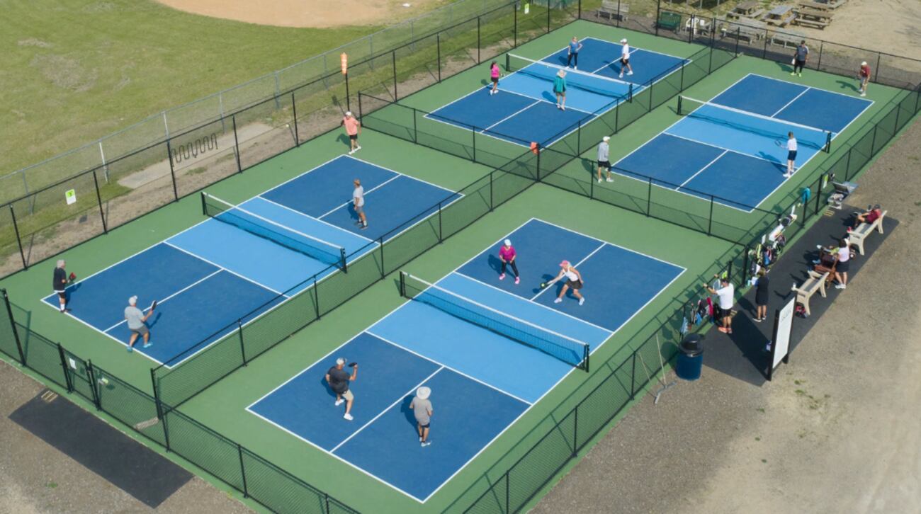 A concept rendering shows what a proposed pickleball facility at Blue Eagle Park in...