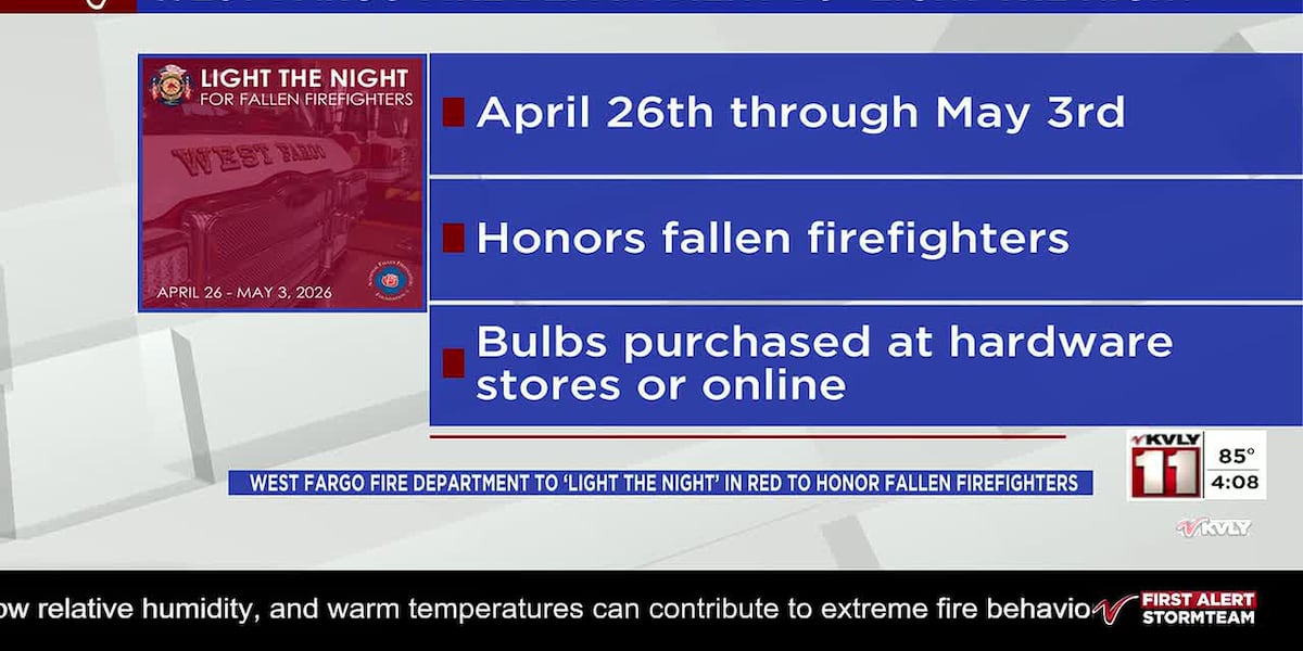 Departemen Pemadam Kebakaran West Fargo menerangi malam dalam warna merah untuk menghormati petugas pemadam yang gugur